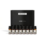 Luxury Hotel Diffuser Fragrance Oil Set - 8 VINEVIDA 10mL amber glass oil bottles lined up in front of black "Sold as Set" gift box