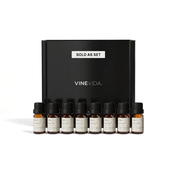 Feminine Soap & Candle Fragrance Oil Set - 8 VINEVIDA 10mL amber glass oil bottles lined up in front of black "Sold as Set" gift box