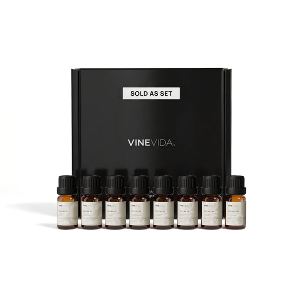 Christmas Soap & Candle Fragrance Oil Set - 8 VINEVIDA 10mL amber glass oil bottles lined up in front of black "Sold as Set" gift box