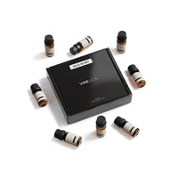 Clean Diffuser Fragrance Oil Set - 8 VINEVIDA 10mL amber glass oil bottles arranged around closed black "Sold as Set" gift box, flat lay overhead angle