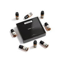 Summer Diffuser Fragrance Oil Set - 8 VINEVIDA 10mL amber glass oil bottles arranged around closed black "Sold as Set" gift box, flat lay overhead angle