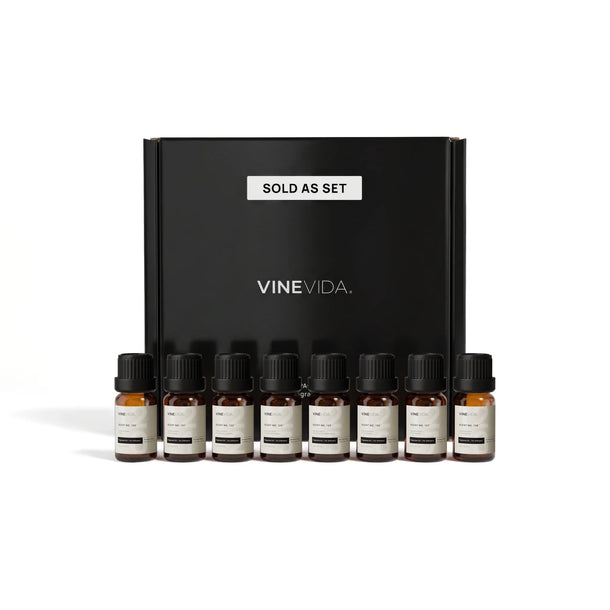 Winter Diffuser Fragrance Oil Set - 8 VINEVIDA 10mL amber glass oil bottles lined up in front of black "Sold as Set" gift box