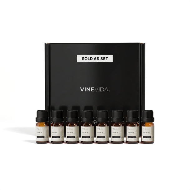 Christmas Diffuser Fragrance Oil Set - 8 VINEVIDA 10mL amber glass oil bottles lined up in front of black "Sold as Set" gift box
